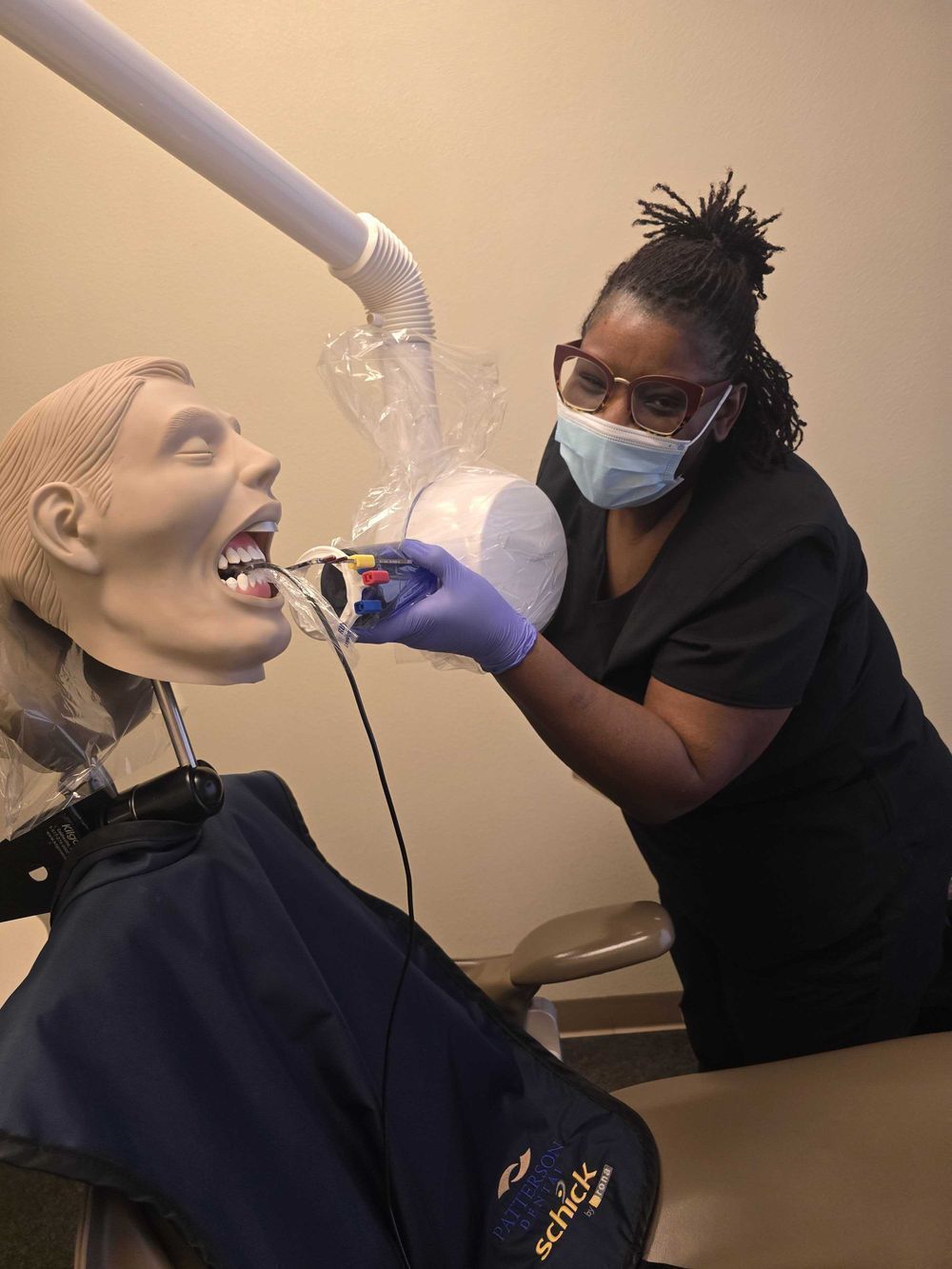 Dental assistant student learning entry-level skills